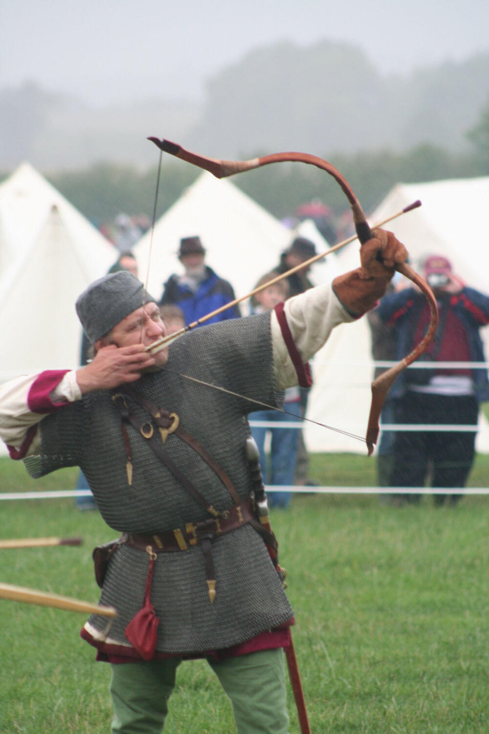 A Roman archer shooting an arrow at a re-enactment